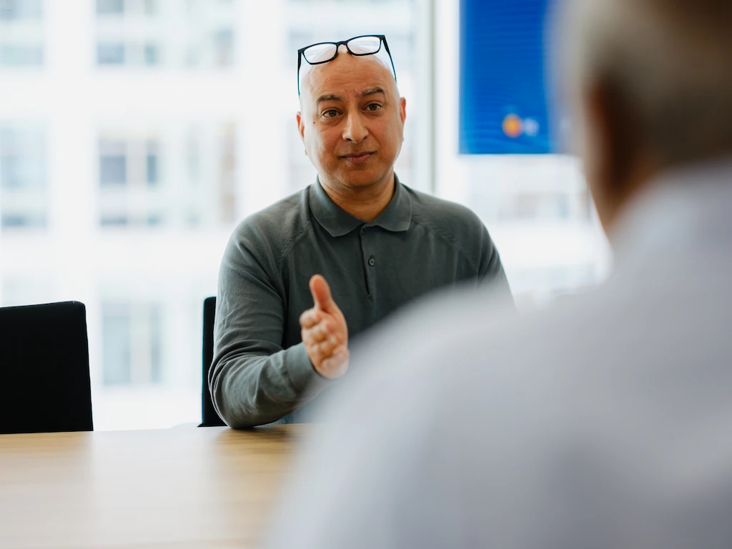 Consultant leading one-to-one business discussion focused on CFO strategy and financial decision making
